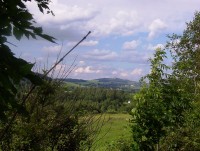 Uhlířský vrch(671,7 m) s kostelem a Moravskoslezským Kočovem od Tylova-Foto:Ulrych Mir.